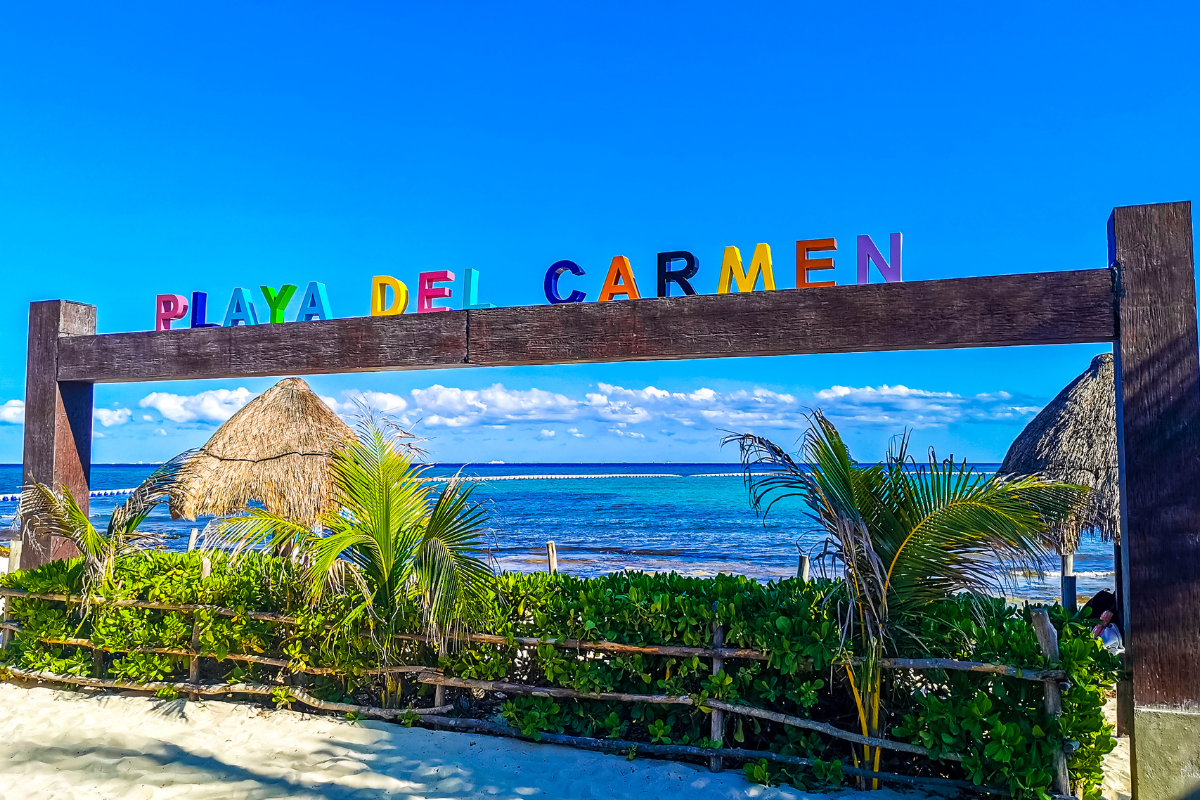 Playa del Carmen sign in front of the beach in Mexico