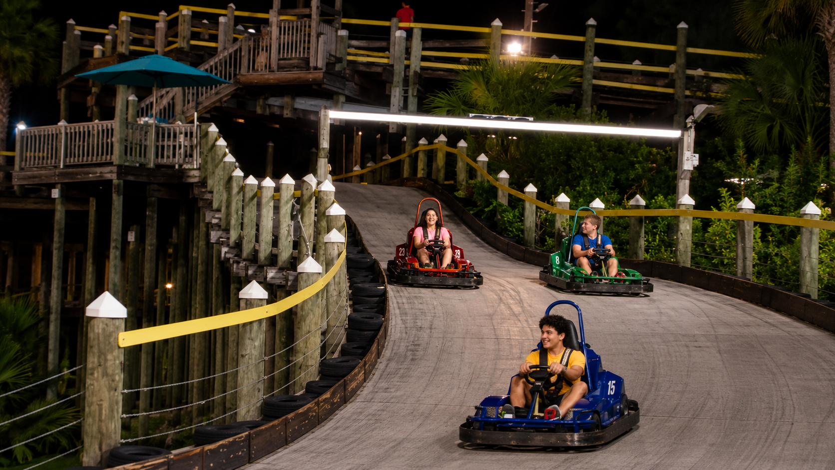 Kids racing golf carts at The Track Gulf Shores