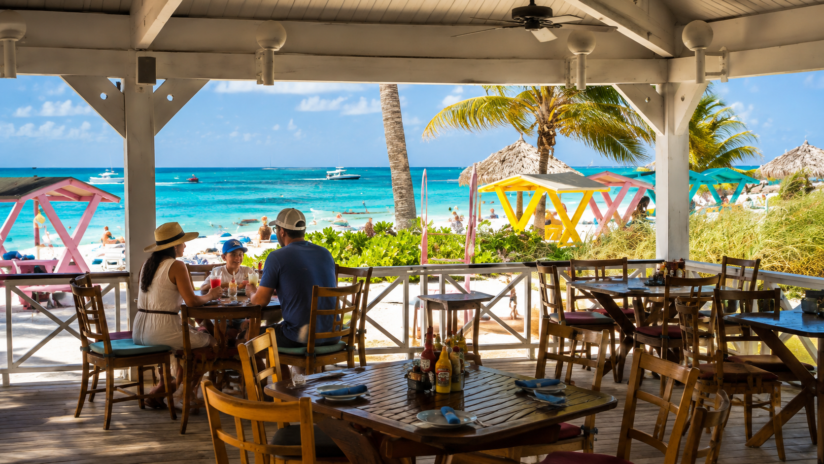 Family eating outside on the patio at Taino Beach Baarbecues