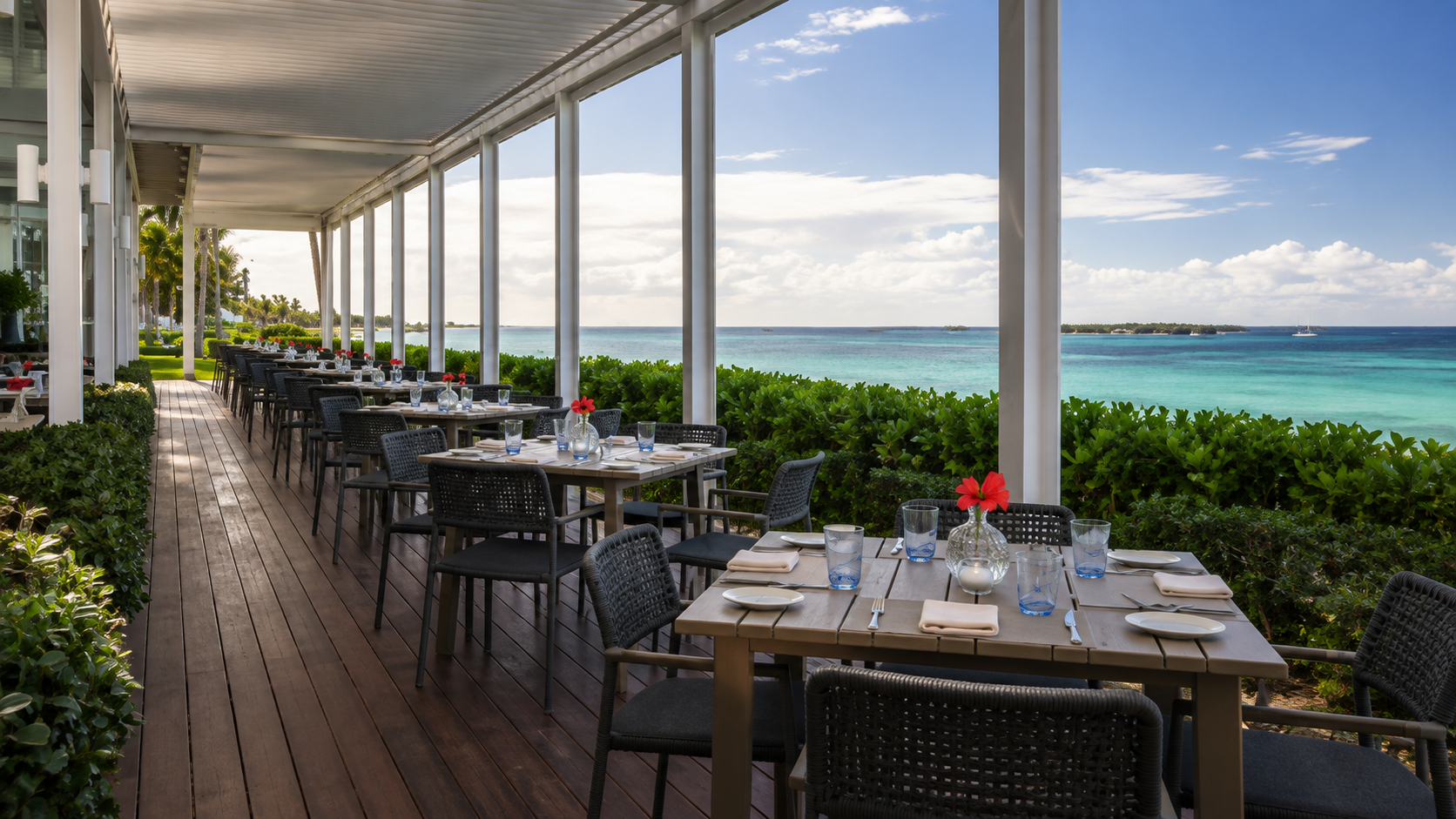 Outdoor seating with an ocean view at Dune at The Ocean Club