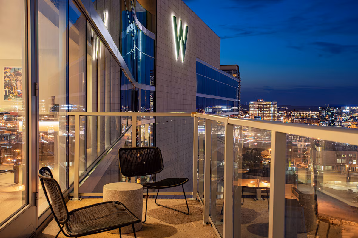 Suite with balcony and city view