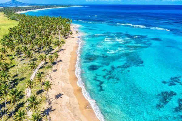 Try surfing at Playa Macao